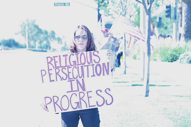 "Sign: Religious Persecution in Progress, November 2008" by John Nakamura Remy. Available via: https://www.flickr.com/photos/mindonfire/3036482000